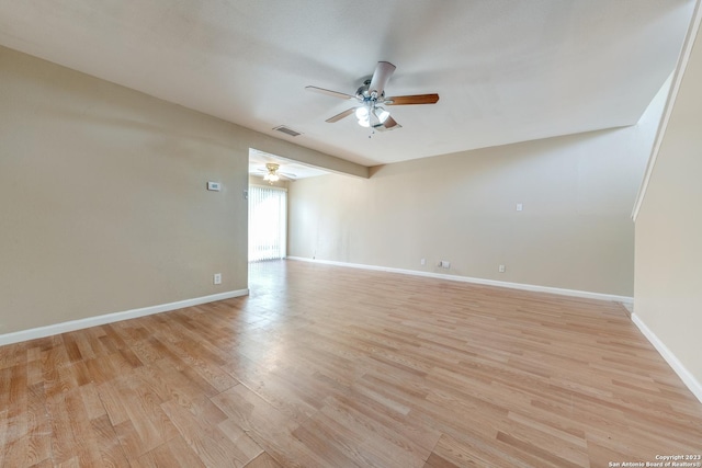 spare room with light hardwood / wood-style flooring and ceiling fan