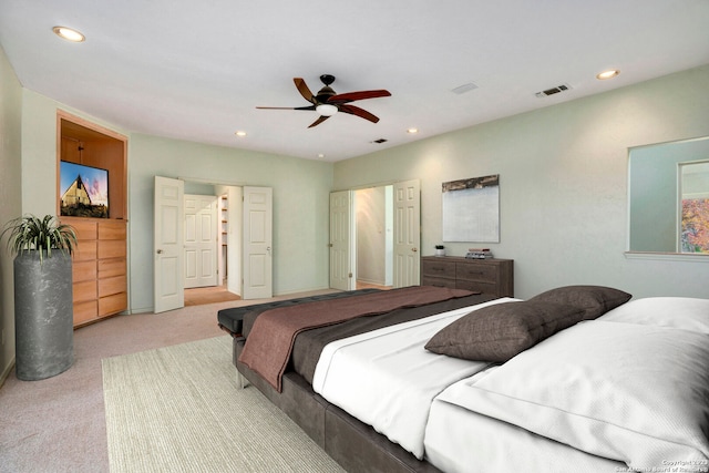 bedroom featuring light carpet and ceiling fan