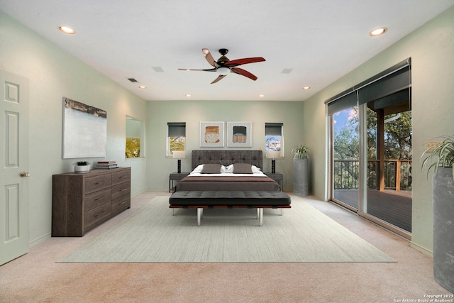 carpeted bedroom featuring access to outside and ceiling fan