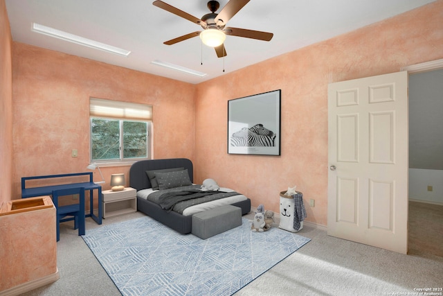 sitting room featuring light colored carpet and ceiling fan