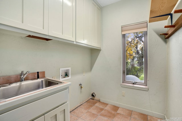 laundry area featuring washer hookup, cabinets, and sink