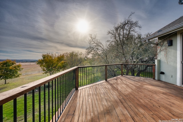 wooden deck featuring a yard