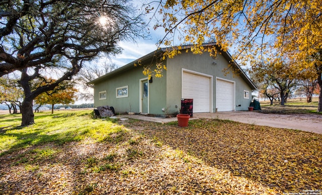 view of side of property featuring a garage