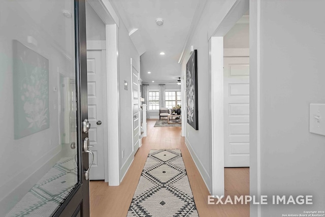 corridor with light wood-type flooring