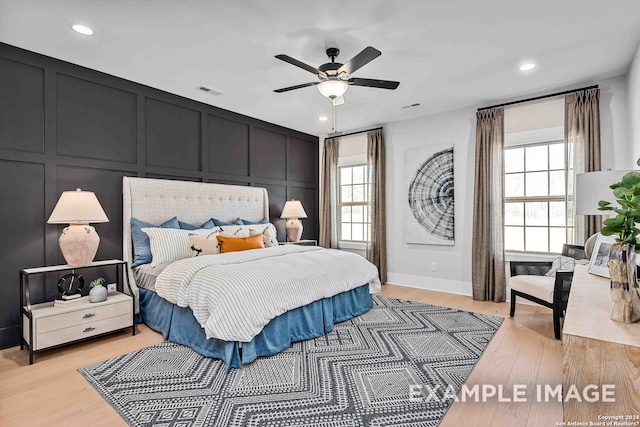 bedroom featuring ceiling fan and light hardwood / wood-style flooring