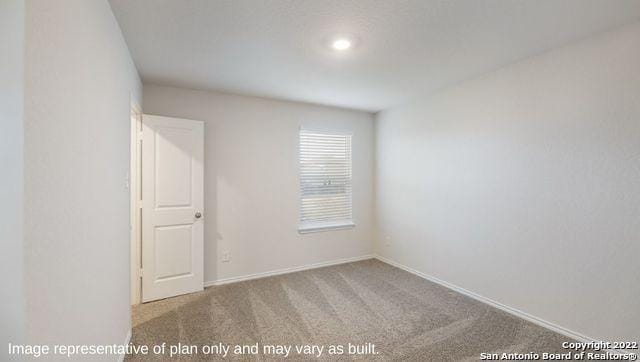 empty room with light colored carpet