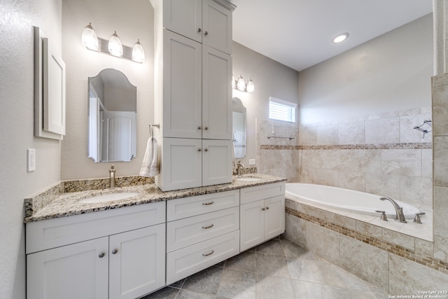 bathroom featuring tile patterned floors and double sink vanity