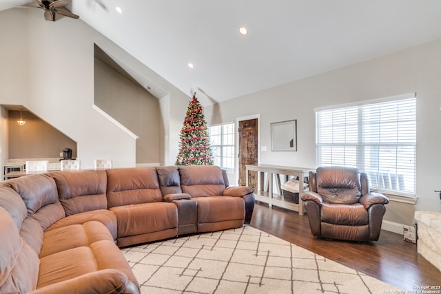 living room featuring light hardwood / wood-style flooring, a wealth of natural light, and ceiling fan