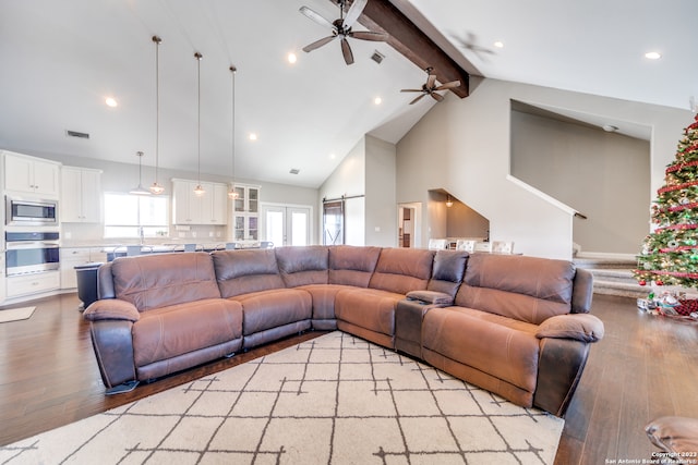 living room featuring light hardwood / wood-style flooring, beam ceiling, ceiling fan, and high vaulted ceiling