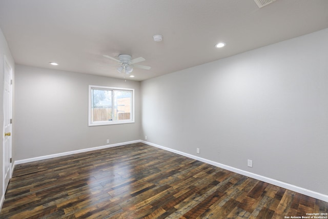 unfurnished room featuring ceiling fan and dark hardwood / wood-style floors