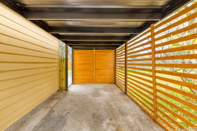 garage featuring wood walls