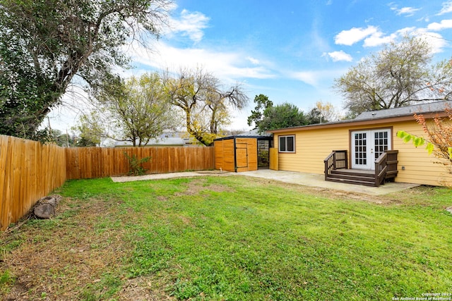 view of yard featuring french doors