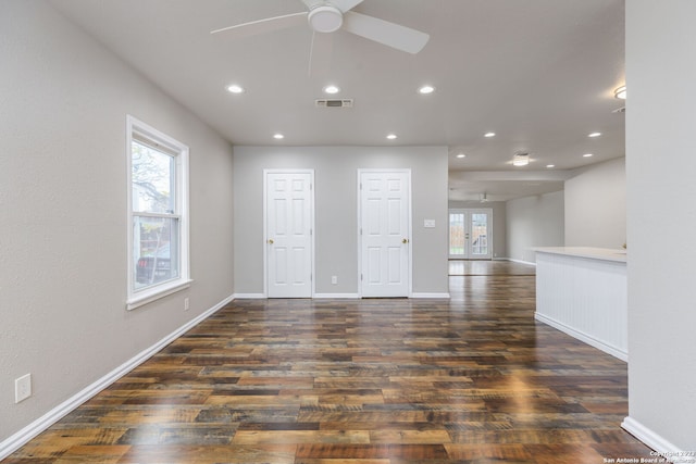 spare room featuring dark hardwood / wood-style floors and ceiling fan