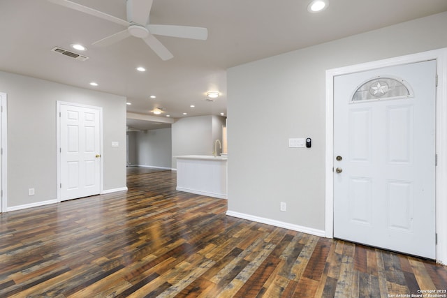 foyer featuring dark hardwood / wood-style flooring, ceiling fan, and sink