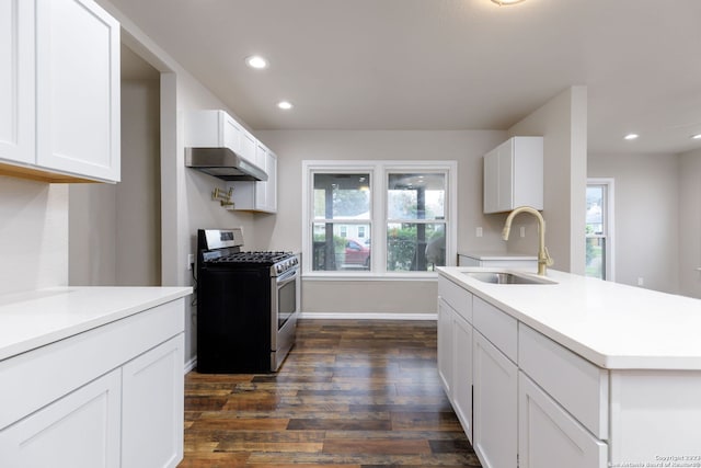 kitchen featuring white cabinets, stainless steel range with gas cooktop, dark wood-type flooring, and sink