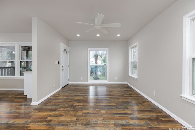 interior space with ceiling fan and dark hardwood / wood-style flooring