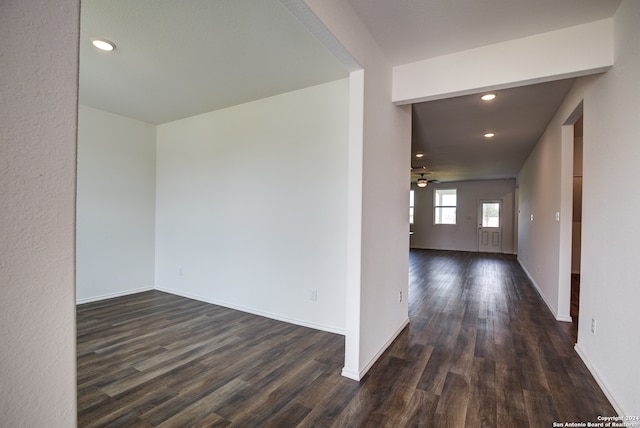 hall with dark wood-type flooring