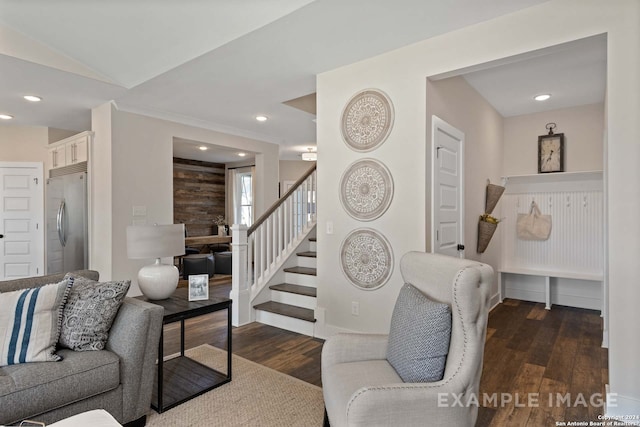 living room featuring dark hardwood / wood-style floors and vaulted ceiling