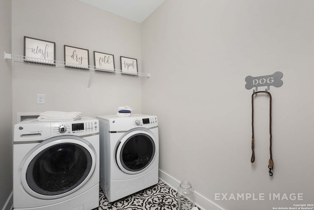 washroom featuring tile patterned floors and washing machine and dryer