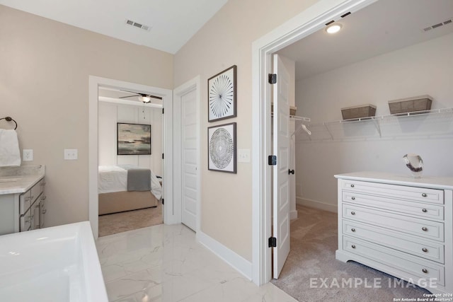 bathroom with vanity and ceiling fan