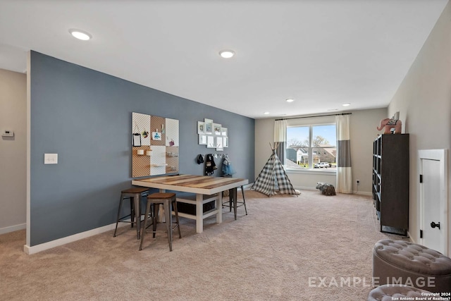 dining room featuring light colored carpet