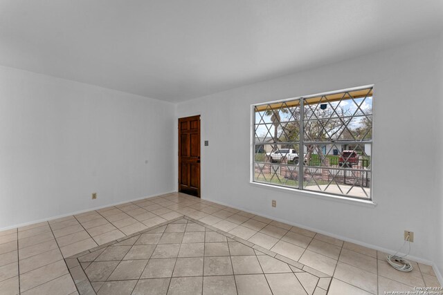 view of tiled spare room