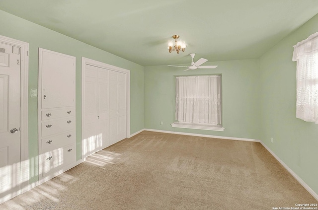 unfurnished bedroom with carpet floors and ceiling fan