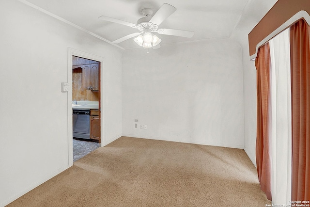 carpeted empty room with ceiling fan and sink