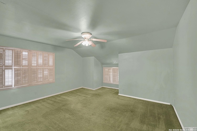 bonus room featuring vaulted ceiling, carpet flooring, and ceiling fan