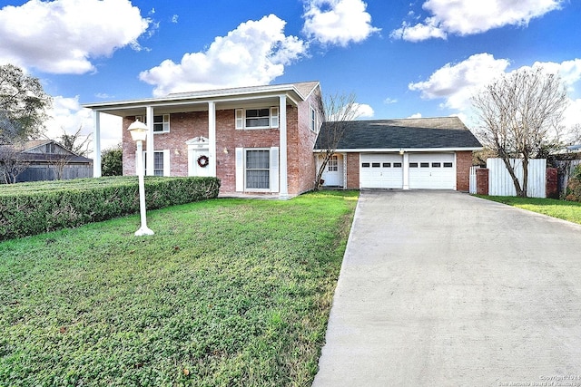 view of front of home featuring a garage and a front lawn