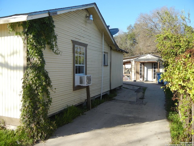 view of side of property with cooling unit