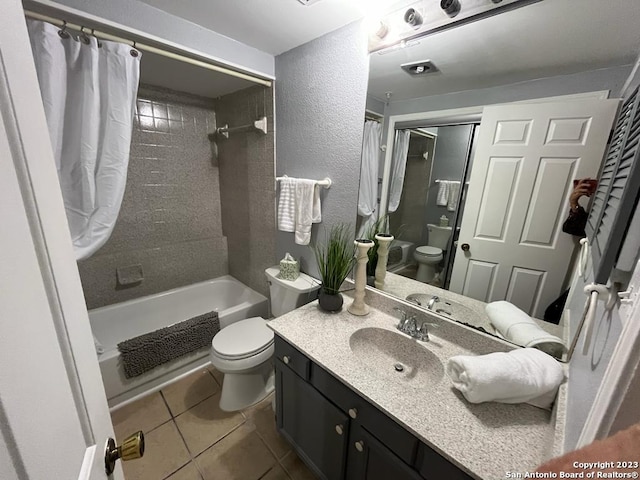 full bathroom featuring tile patterned floors, shower / bath combo, toilet, and vanity