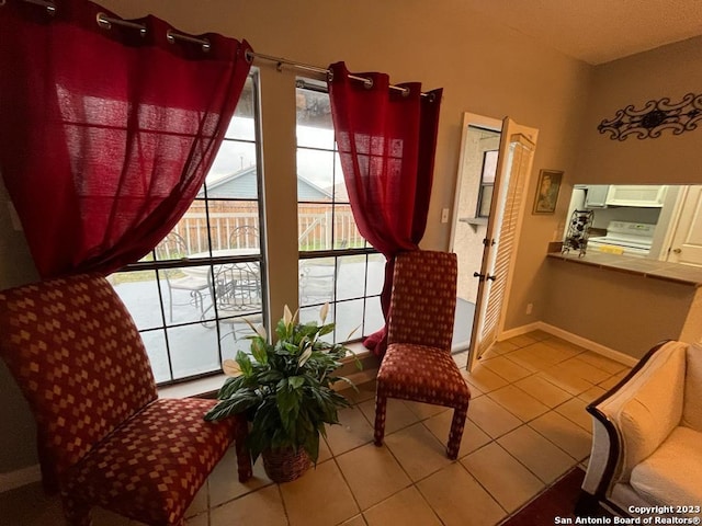 sitting room featuring tile patterned flooring