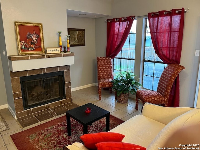 tiled living room with a tiled fireplace