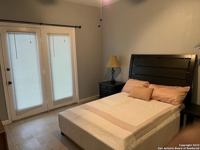 bedroom featuring light tile patterned flooring