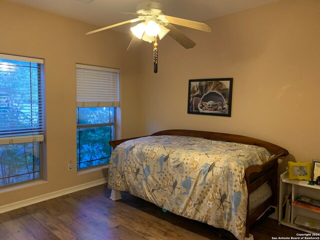 bedroom featuring dark hardwood / wood-style floors and ceiling fan