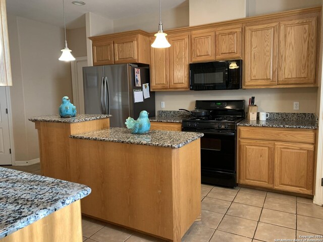 kitchen featuring pendant lighting, a center island, stone counters, light tile patterned floors, and stainless steel fridge with ice dispenser