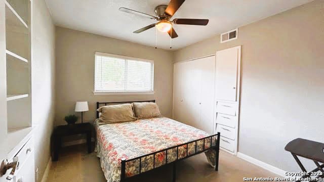 bedroom with a closet and ceiling fan