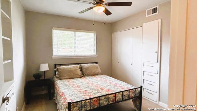 bedroom featuring a closet and ceiling fan