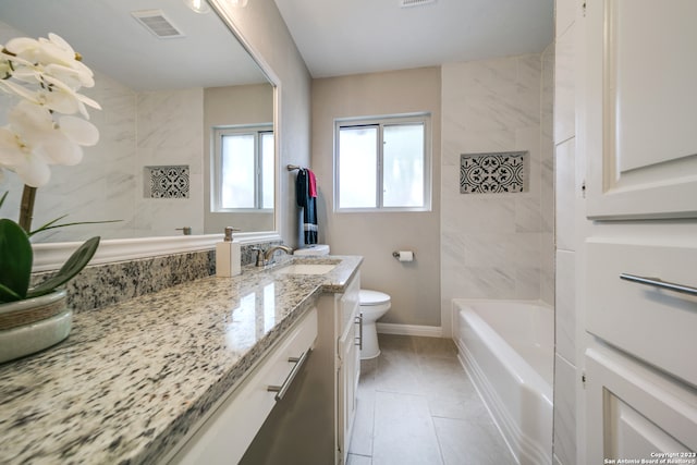 bathroom featuring tile patterned floors, vanity, and toilet