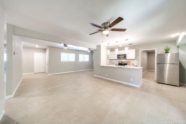 interior space with ceiling fan and light tile patterned floors