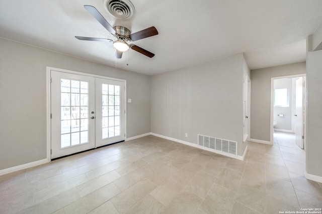 unfurnished room with french doors, ceiling fan, and light tile patterned floors