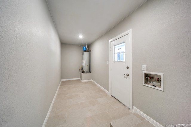 interior space featuring light tile patterned flooring and gas water heater