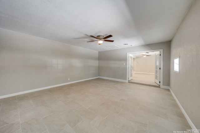 unfurnished room featuring light tile patterned flooring and ceiling fan