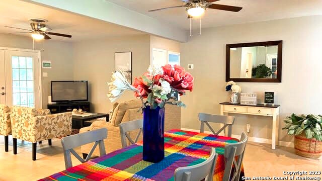 dining area featuring a healthy amount of sunlight and ceiling fan