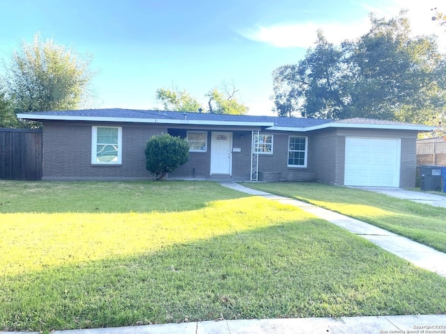 single story home with a garage and a front yard