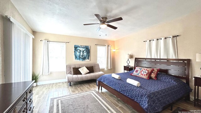 bedroom featuring ceiling fan and hardwood / wood-style floors