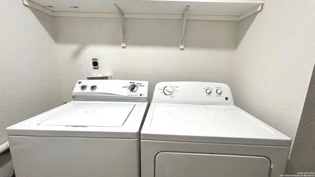 laundry area with washing machine and dryer