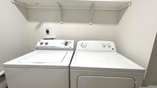 washroom featuring washer and dryer