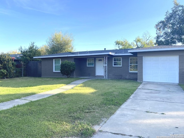 single story home with a garage and a front yard